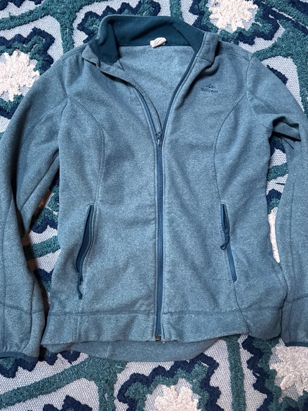 Quechua Women's MH120 Hiking Fleece Jacket features a sweater-knit design and zi